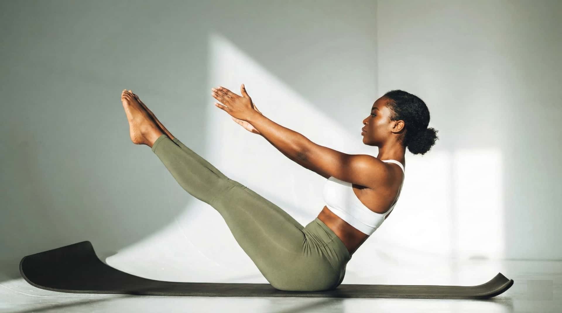 Social media influencer demonstrating lazy girl pilates moves on Instagram