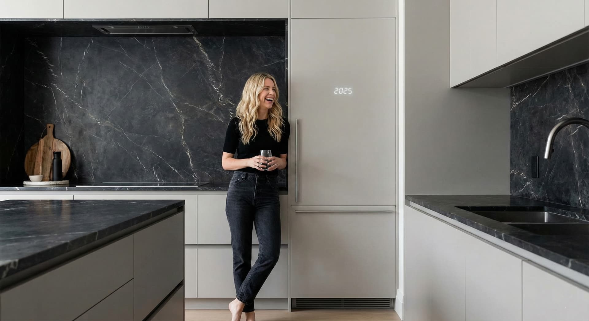 Paneled refrigerator wall with marble slab backsplash