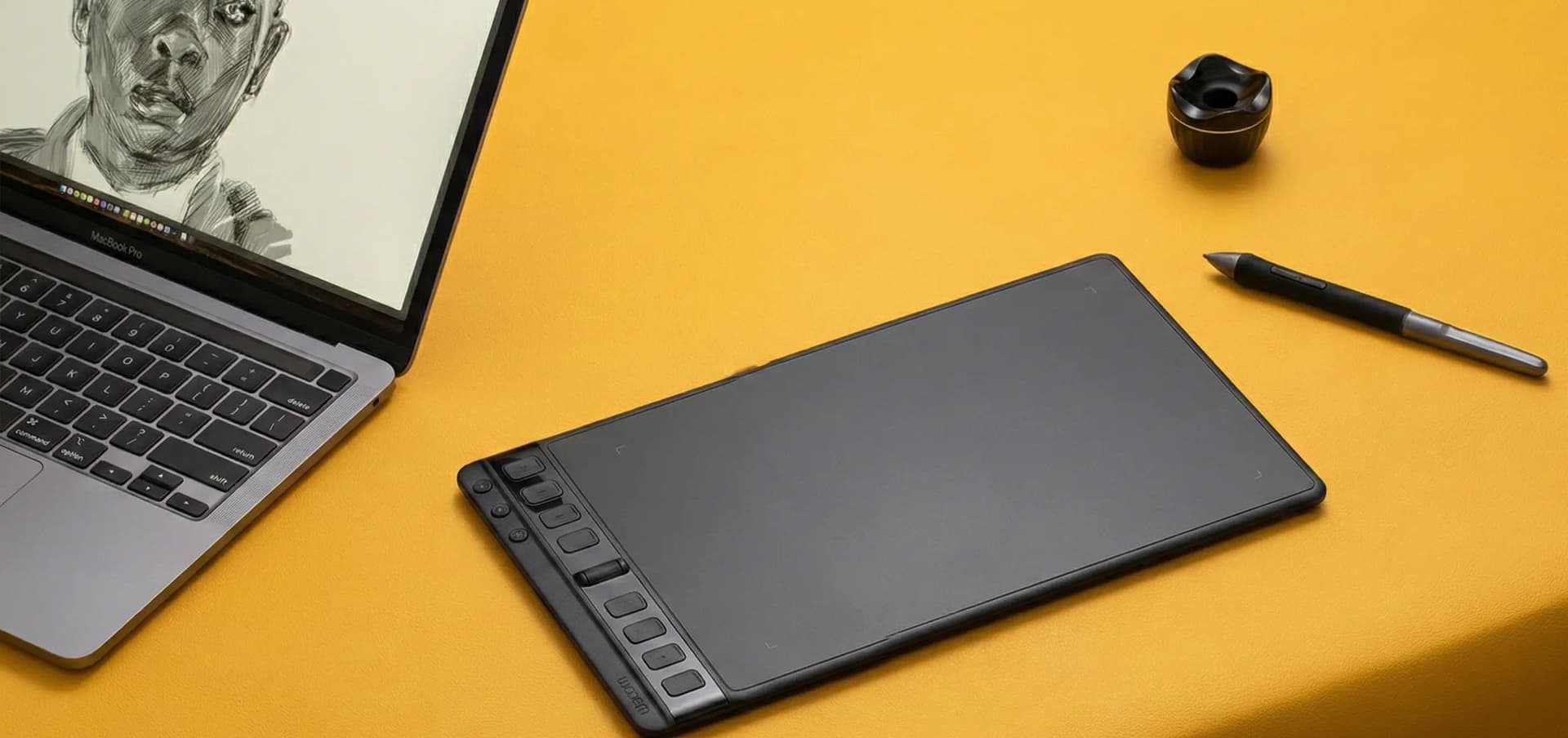 Professional drawing tablet with stylus on a creative workspace