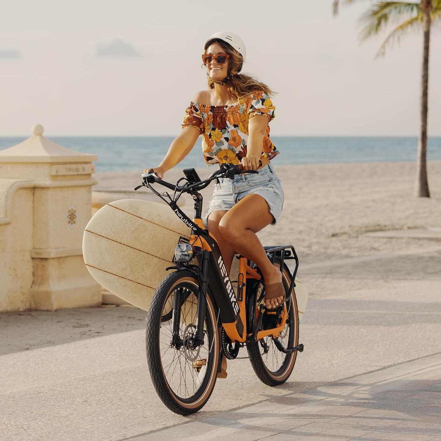 Heybike Cityrun step-through ebike parked near city planter boxes