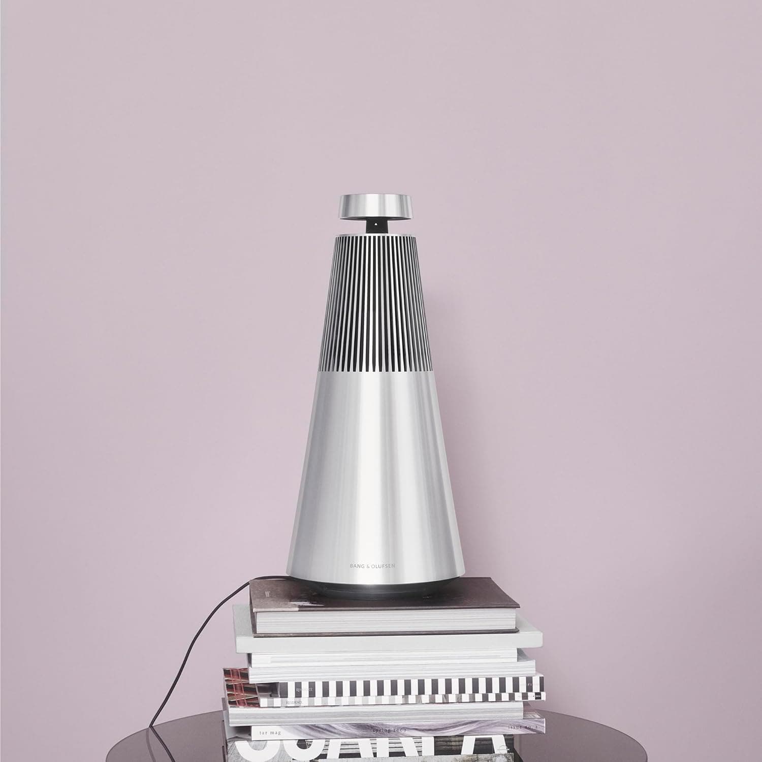 Bang & Olufsen Beosound 2 speaker on a marble side table